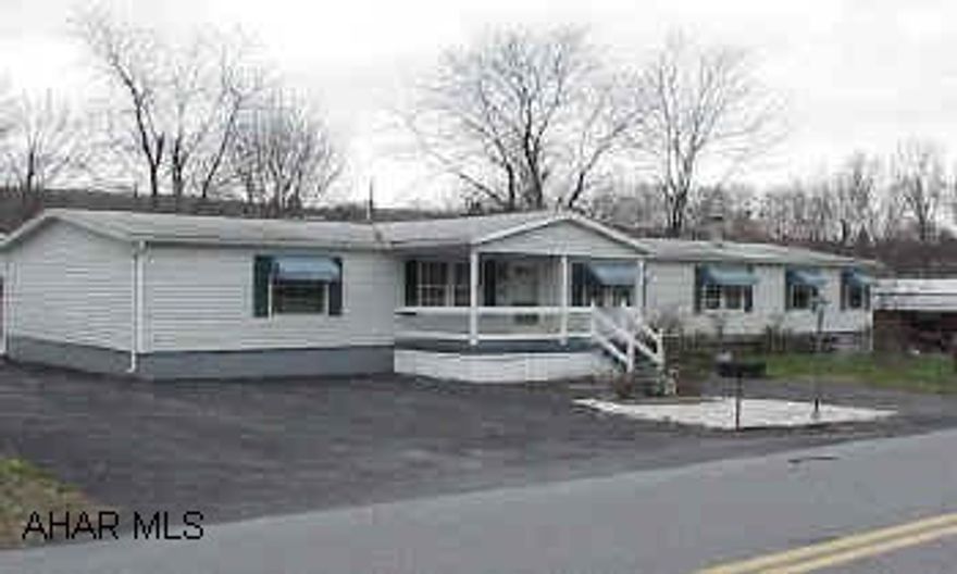 Oak Kit & Baths - Nice floor plan.  Family room with stone fireplace, large heated sun room, & 4 car carport with 8x32 shed.  28x72 Champion on foundation.  Oak Kit & Baths - Nice floor plan.  Family room with stone fireplace, large heated sun room, & 4 car carport with 8x32 shed.  28x72 Champion on foundation.