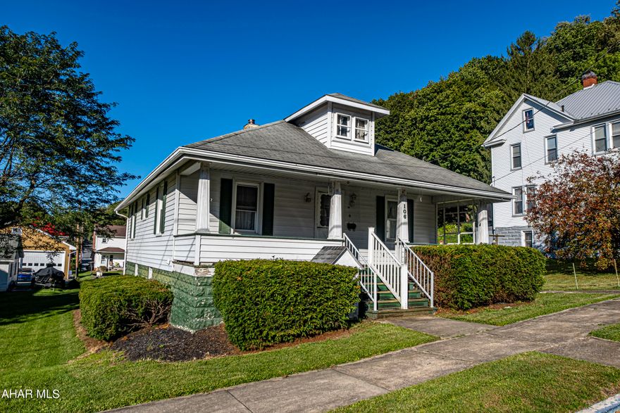 Quaint 1 1/2 story home in the Williamsburg Boro.  This home features 2 nice size bedrooms and full bath.  A large open living room and dining room for relaxing and dining.  The half story is not finished but would make a great extra room. Enjoy the covered front and back porches.