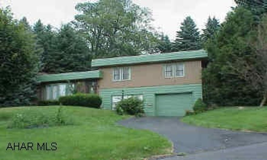 Plaster walls and oak hardwood floors - Rubber roof - Gas fireplace - Seperate 2- car detached garage - Basketball Court.