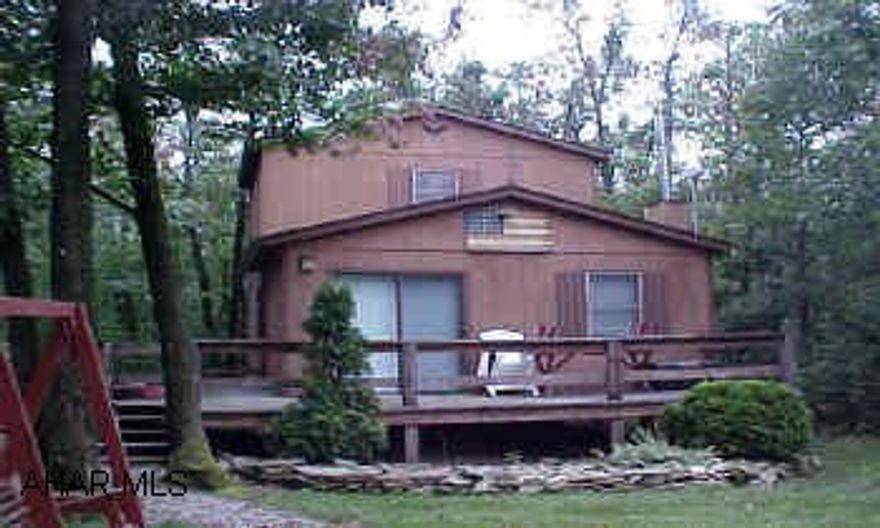 Inviting cottage located in "gated" Buck Run Subdivision. This cottage offers a living room with a vaulted ceiling, kitchenette, first floor bedroomwith walk-in closet, utility room, a second level with two bedrooms. Enjoy the peace and quiet from the front deck of this cottage. Association fee of approximately $60.00 per year. Attic for storage. Furnished.