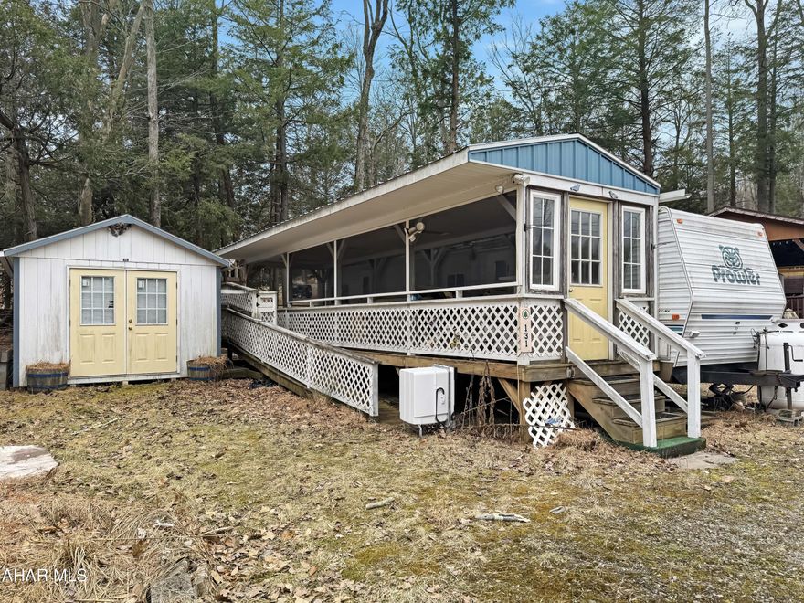 Don't miss this incredible opportunity to own a generous campsite in the highly sought-after Glendale Yearound Community! This unique property spans three lots, providing ample space for privacy & relaxation. It includes a storage shed, a large covered deck perfect for gatherings, & a camper. Please note that the camper is currently believed to be in unrepairable condition & may require removal, depending on the buyer's plans. Property being sold ''AS IS''. For more information, call us today!