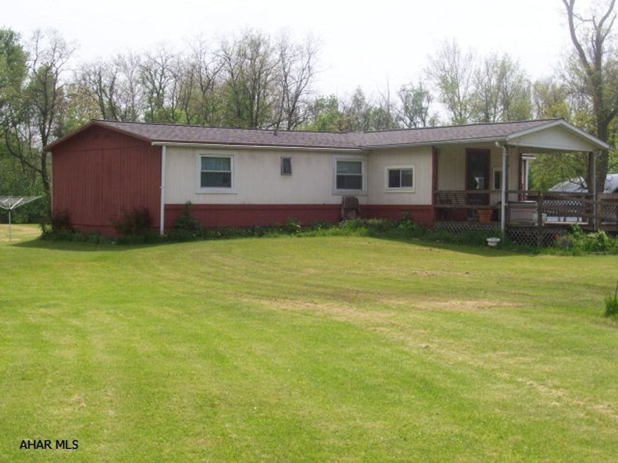 Location, Location, Location! Behind the Meadows in Wye Switches.  Seven flat acres, surrounded by woods, super large metal building, garage, workshop with electric.  3 Bedroom double wide on full basement, 1.5 Bathrooms, main floor laundry, 2 porches to take advantage of.  Private yard.  Priced to sell. Trailer on property will be removed and does not go with the property