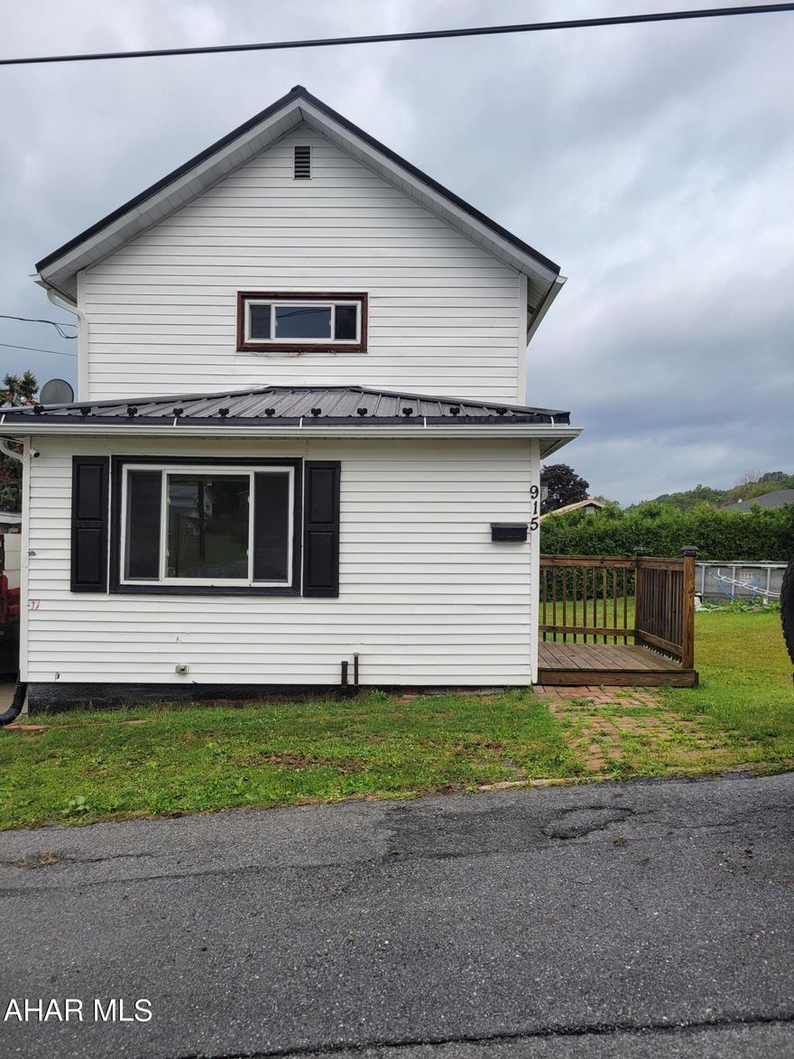 Great starter home!  2-bedroom, 1 bath, 2-story home w/fenced in backyard and off-street cement parking pad w/partial cover.  First floor laundry, eat-in kitchen.   Metal roof.