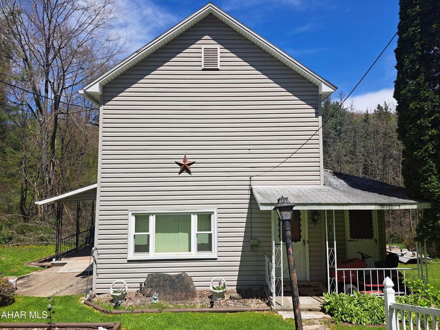 This 2 story home is located in the Glendale Area School District, nestled on over 2 acres of mostly wooded land with a stream. This peaceful location just 10 min. from Prince Gallitzin State Park, features one-floor living with one bedroom, the bathroom, and laundry room located on the first floor.  The second floor has 3 additional bedrooms. The on-lot sewage discharges into the stream.