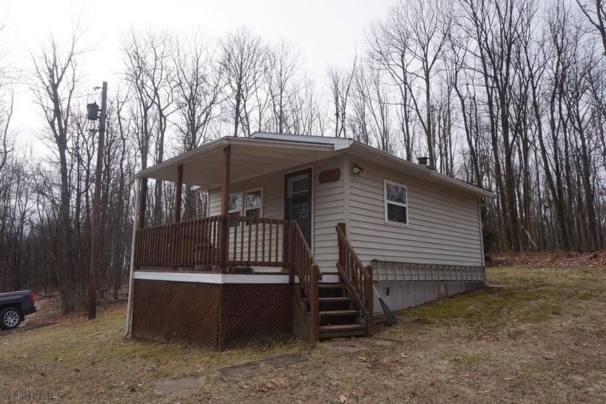 Cozy Camp located on 38.73 private wooded acres just 19.5 miles to State College. It's a hunter's private paradise with an abundance of wildlife to include bear, deer & turkey. The cabin features a kitchen, living room, 1 bedroom & a full bath, electric heat, wood cookstove is only used if the electricity would go out & a private well. There is a private locked gate to the property. This mountain retreat is the perfect place to restore your soul. The current septic system in place is being SOLD AS-IS. Cash, conventional, or swing/HELOC loans.