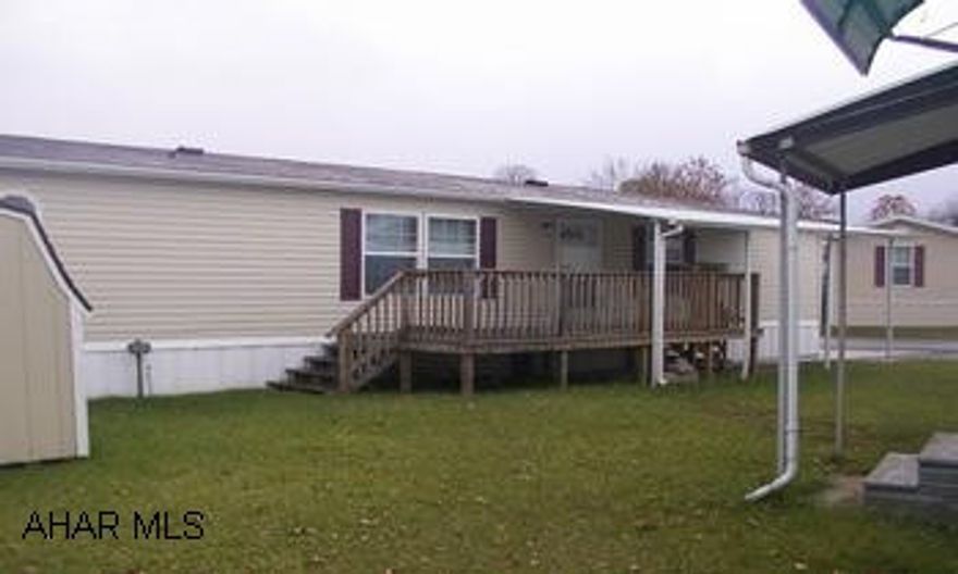 Immaculate 28 x 56 Redman doublewide, 2002, in excellent condition, covered deck, carport, shed.  Lot Rent -$255 includes garbage, off-street parking for 4 cars,. 55 & older Eldorado trailer park, all appliances included.  Just move in!