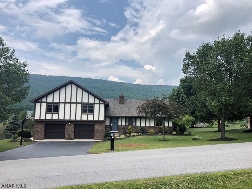 Looking for a large spacious home with a spectacular view of Scotch Valley this is the one for you!  Large living room with wood burning fireplace, Kitchen has plenty of cabinets, solid surface counter tops, eating area and features all new lighting, formal dining area and foyer completes this level.  Family room has new lighting and is attached to laundry and half bath.  Upper level has 4 bedrooms and 2 baths.  The master bedroom has a balcony with an amazing view of the Valley.  Recent renovations are new lighting, trees cut down to open view off of balcony, landscaping, driveway sealed, main level and family rooms painted, front step corrected, carpets scrubbed throughout home.  Newer roof and hot water heater in 2016.  Close to golf course!  Call today before it is gone!