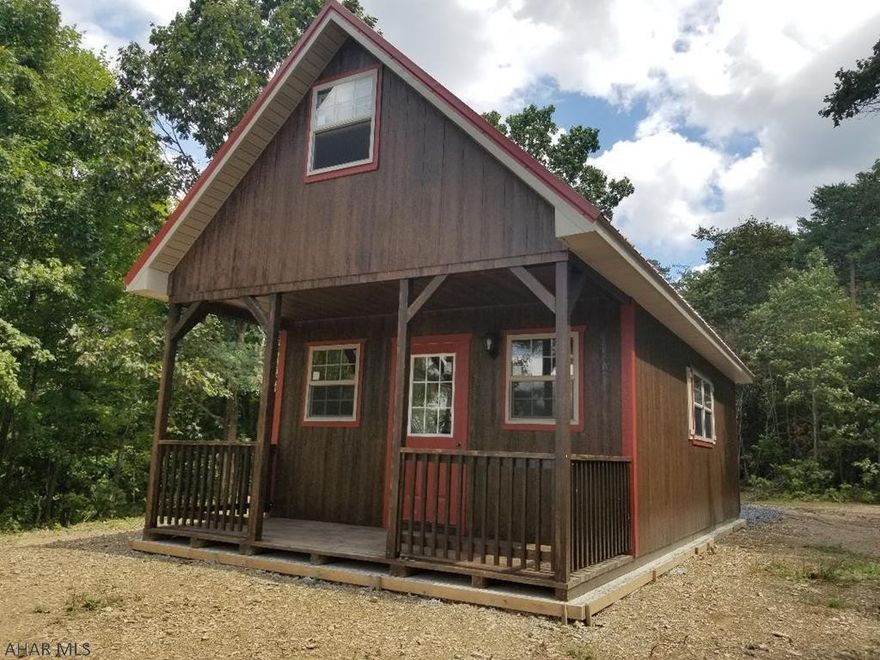 45+or- acres of pure paradise... don't miss this one... Beautiful cabin with electric , water and sewer ,2 perk test approved building sites, amazing views,  great hunting , private access with roads and driveway already cut onto the property,  a fairy tale location, minutes from Shawnee state park