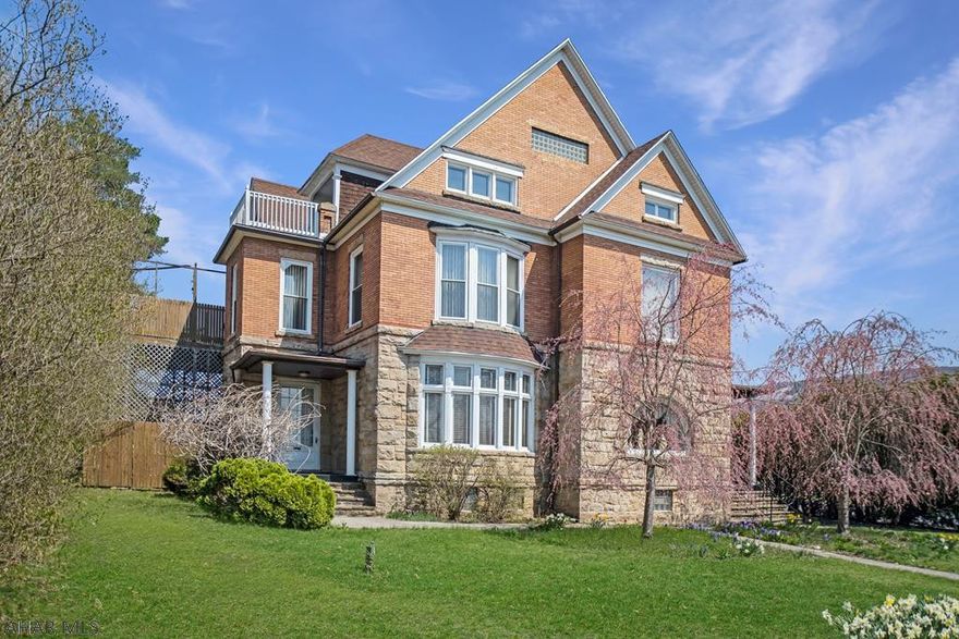 Magnificent hewn stone and brick mansion situated on a large 1+ acre lot in the borough of Bellwood. Features include high ceilings, original woodwork, multiple fireplaces, large arched window and a spectacular bay window. The main level is currently used as a funeral parlor but could be converted to office space or bed & breakfast. Second floor is currently a two bedroom apartment and the third floor is also a two bedroom apartment. There is a large detached garage and off street parking for 32 vehicles. No zoning provides for limitless options including converting back to a single family residence. Check out our 3D virtual tours and video.
