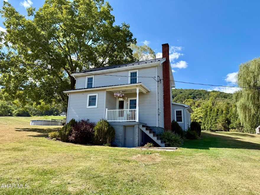 Enjoy the best of country living with this charming home on a full acre, offering stunning views of the Pennsylvania mountains. Step inside through the spacious front entry to a welcoming dining room that connects seamlessly to the large living room and the kitchen with beautiful wood cabinets and seeded glass. Each room on the main floor flows easily into the next, creating a comfortable and inviting layout. The oversized mudroomâ€”also serving as the laundry areaâ€”adds convenience, and a bathroom with a walk-in shower completes the main level. 
Upstairs, you'll find three comfortable bedrooms and another full bathroom.

Outside, there's plenty of room to spread out with ample parking, a large two-car garage, a refreshing above-ground pool, and a covered deck perfect for relaxing or entertaining. All this while being less than 30 minutes to Altoona and just 15 minutes to Martinsburg.

This home offers the perfect blend of peaceful country living with a smart, flowing layoutâ€”schedule your showing today!