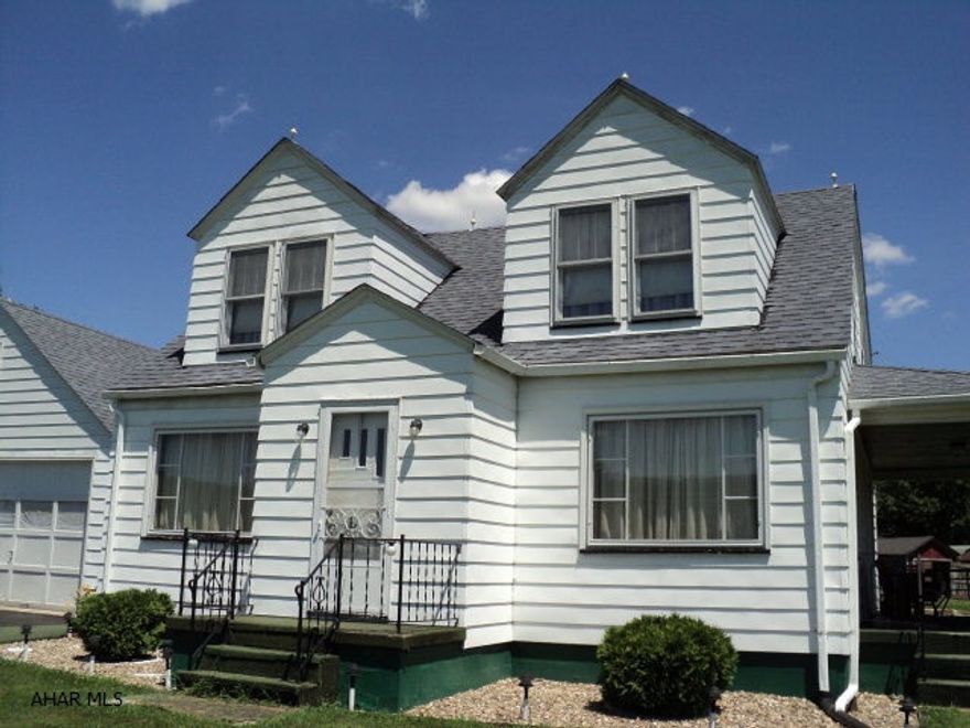 Cape Cod four bedrooms one full bath. Kitchen has room for a small table.  Dining and living room along with a room as a den or office make up the first floor.  Large covered porch to sit and enjoy your surroundings. Attached two car garage with a loft area accessed from an outside stairway.  The barn and out buildings are in good condition and there is a pond on the property. Electric is run to barn and at least on of the out buildings.  This property would make an excellent place to raise horses or a few beef cattle.  Property Taxes include a Homestead exclusion re the school taxes. Taxes break down as follows: County $393.90, Township $49.20 and School (2014) $850.03.  City water in street and a tap is in place for possible hookup to city water.