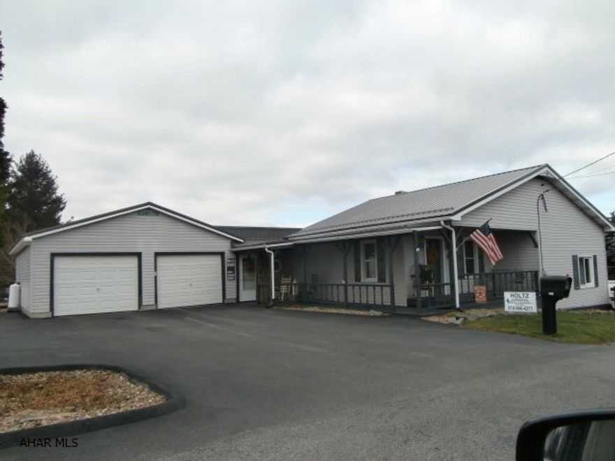 Beautiful ranch home that appears as new! New oak eat in kitchen, large living room, den or office, two good sized bedrooms, two 3/4 baths, attached oversize two car garage, paved drive and parking, small barn/storage shed. Great home that's move in ready!