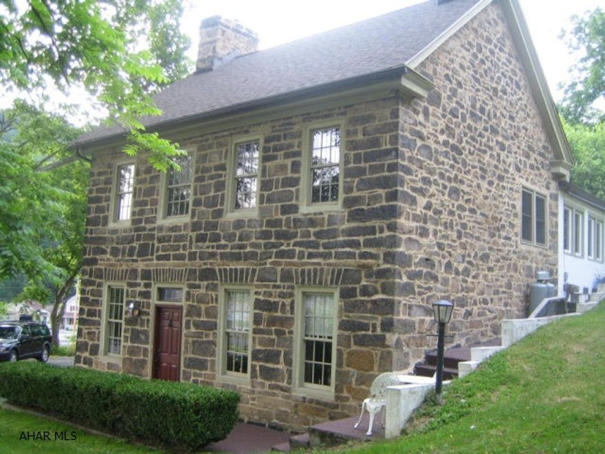 Steeped in history, this c1795 home has been lovingly restored retaining much of its original character blended with modern conveniences.  Included are 5 fireplaces, random width original pine floors, period hardware, deep window sills, archways, pie stairs, antique tin ceiling, and artist painted cabinetry/floors/walls. The main home includes 4 BR's; each with private, custom tiled baths. An exquisite carriage house with 2 fully furnished efficiencies is ready to generate income or become a restful retreat for friends and family. Set on over 5 acres, this property awaits the B&B owner/ gentleman farmer/animal enthusiast. The convenient location affords access to biking/hiking trails, fishing, historic downtown Hollidaysburg, shopping, restaurants, and I-99. 1 year home warranty.