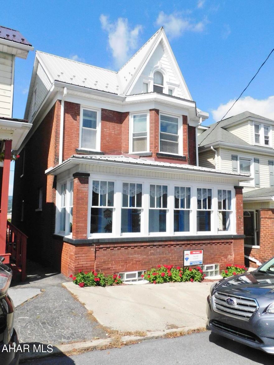 This 3 or 4 Bedroom home is extremely well maintained and so clean - great space in basement laundry and tons of storage. Kitchen is bright and offers a walk in pantry. Nice sized bedrooms and attic can be anything you want - bedroom, play room etc. Thermo pane windows & metal roof and freshly painted exterior makes this all complete. The flower garden in back leads to offstreet parking for 2 - so easy in & easy out.