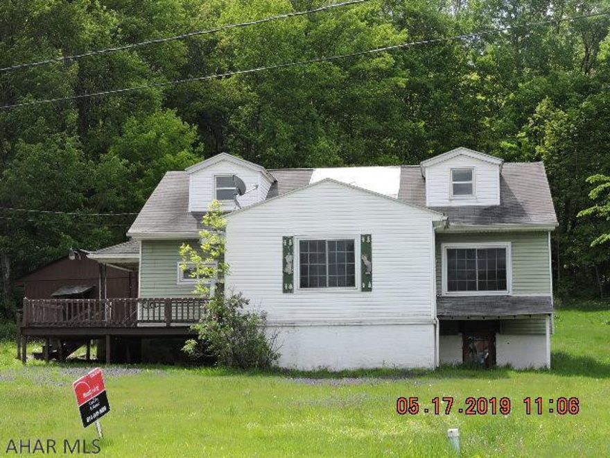 Great lot and location.  This 1 1/2 story home has great potential too.  1st  floor bedrooms and bath with 1st floor laundry.  Large outbuilding has a workshop in it.  Some freeze damage.  Sold in its present  "As Is" condition with no warranties and representations by Seller.  Buyer will be responsible for Central Mainline Sewer Authority mandatory sewer test and any subsequent repairs if any.