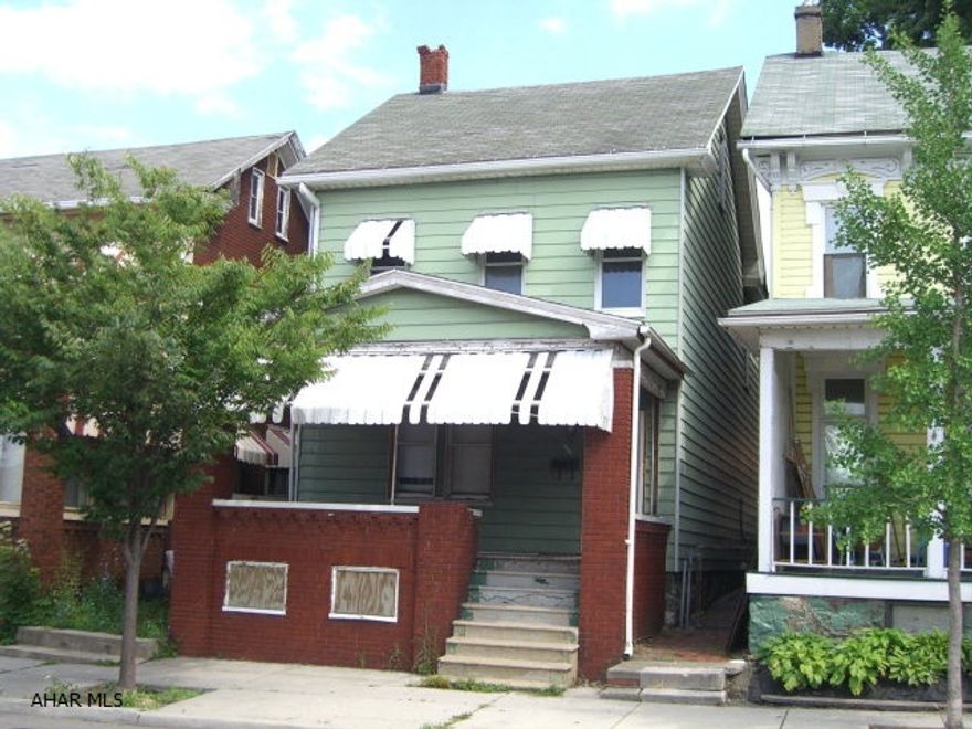 INVESTORS- With just a little TLC, this spacious home has newer carpeting a rebuilt forced air furnace and a detached garage.