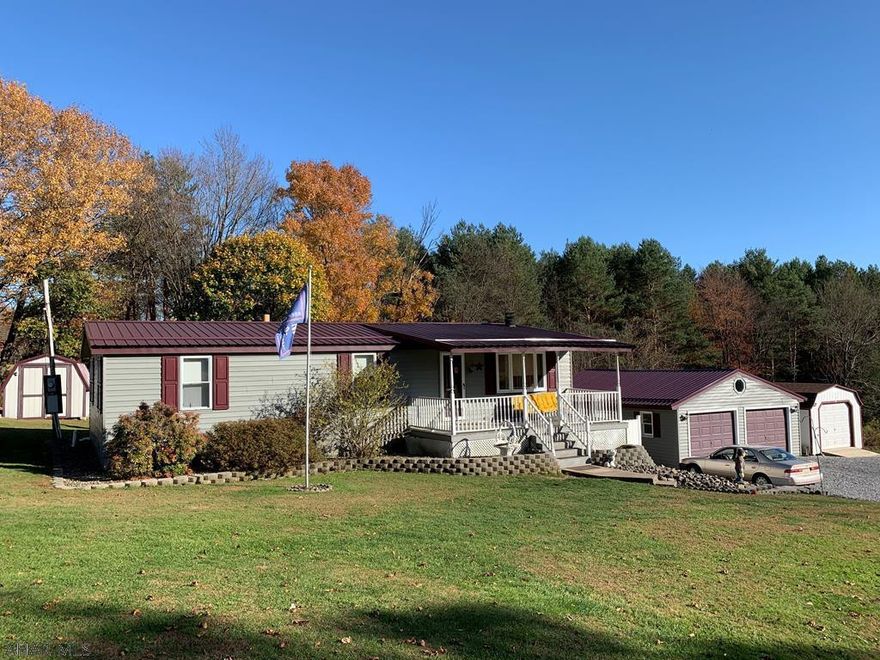 Remodeled 4 bedroom, 2 bath doublewide on 1.35 acre, two parcel lot in Morrisdale.  Finished basement with second kitchen. Detached two car garage.