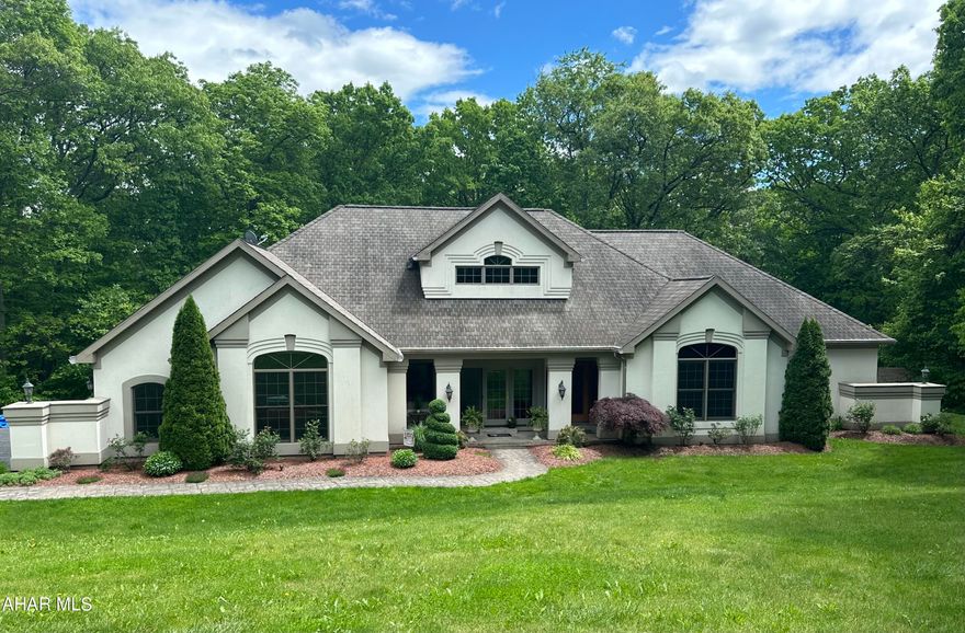 Welcome to your Alleghany Mountain sanctuary!  This stunning custom built home boasts quality finishes with an abundance of natural light that dances through the generous walls of windows that dominate this incredible home.  Step into a world of warmth and comfort as you enter the open concept living space.  

Embrace the tranquility of the gorgeous backyard oasis from the floor to ceiling windows while creating lasting memories with loved ones.  With excellent schools and amenities just a stone's throw away, this home offers convenience while enjoying the solitude of a quiet cul de sac tucked away in one of the area's most highly sought-after neighborhoods in Bedford County.

One can imagine the joy that come from entertaining guest and family while preparing meals. The spacious kitchen allows exterior and interior rooms to blend seamlessly while enjoying family and friends.  

This is a dual master suite home which creates privacy for both homeowners and guest.  Each suite incudes walk in closet as well as separate baths.  The guest suite also includes its very own private deck.  To add to the appeal, there are another two additional bedrooms and guest bathroom.

If energy efficiency is a high priority, this home will not disappoint with its  radiant floor heat found on the main and lower levels.  Also, a three car oversized garage adds to the appeal.

The lower level offers a two story attrium, home office, work out room and huge entertainment space which all open up to a wonderful backyard with incredible privacy.

Outside the home's exceptional landscaping makes this home's curb appeal sensational.  

This home does not disappoint... Call now .. it will not last long!


.