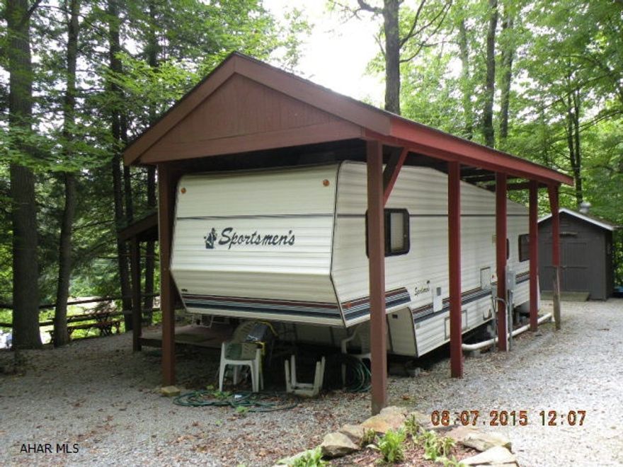 Great get-away. 30 ft 5th wheel under a full pavillion with addition. Nice LR, fully furnished. Quiet, peaceful site. Minutes from State Park & State game lands