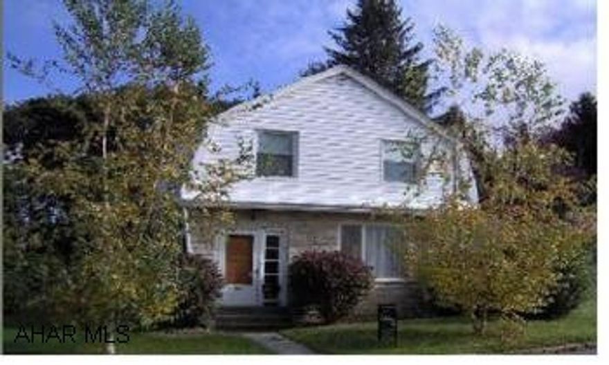 2 story brick / vinyl 4 BR., 2 bath home with new wood floors and carpet  on a corner lot w/ a fenced in yard