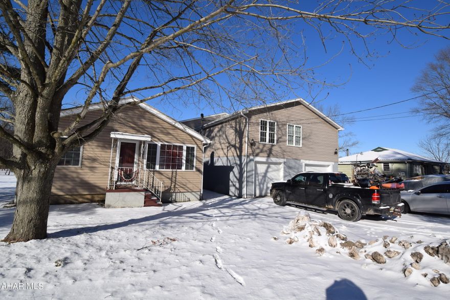 Nicely remodeled home with large, newer two story addition.  This is a home you can really spread out in!   Two bedrooms and full bath in main section of the house.   Addition features a great room with bar,  half bath, and wood burner.   Also featured on the second floor of the addition is an owner's suite with dressing room and large bathroom with jetted tub and stand alone shower.   The fourth bedroom is also found on this level.  
There is a 22 X 24 rear deck.   Country living just minutes to town.