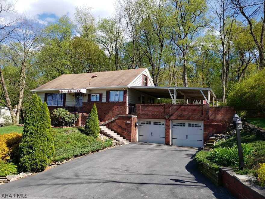 Situated on a professionally landscaped half-acre lot is this lovely home located above the Toy Town section of Altoona. Features include a spacious living room, eat in kitchen, dining room with wood burning fireplace, as well as a large bedroom and full bath on the main level.  Entertaining will be a breeze under the large covered deck or in the finished basement of the home. The property is well maintained and has hardwood floors and the original woodwork throughout. Additional features include a new hot water heater, newer gas forced hot air furnace, central air, as well as plenty of closet and storage space. The backyard is very private, and is the perfect place to kick back and enjoy nature after a long day. All appliances are included in the sale of the property.  See 3D tour soon!