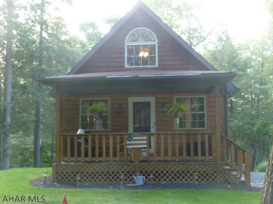 Good things come in small packages!  Sit on the front or back porch before entering to watch the wildlife.  Step into your own relaxing get-a-way.  Sit in front of the fireplace in the living room or fix a snack in the kitchen where you will find extra room for preparing due to the convenient island.  There is plenty of room at the adjacent eating area to sit six for dinner.  Tired?  You have a choice of a first floor bedroom (adjacent to the kitchen if you get hungry in the middle of the night) or the loft bedroom where you can get up in the world.  Full bath on the main floor.  Ease on downstairs to unwind by getting some tanning time or watching the propane fire.  Step outside the sliding glass doors to try out the swing or toast a hot dog while sitting around the fire.  Spacious shed.