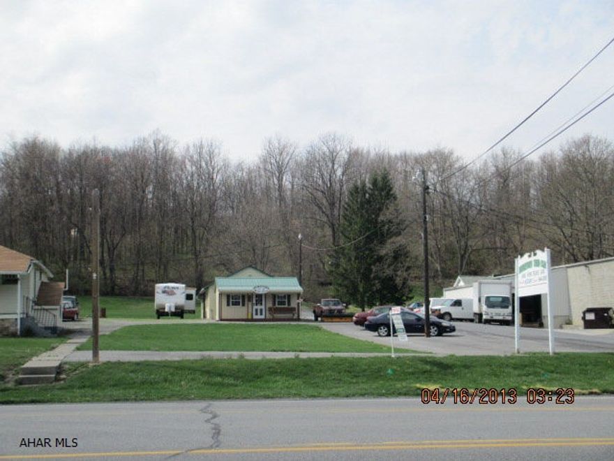 Presently a car lot.  One story home 24' x 35', shed 12' 18', office and 4 car garage 22'x 44'. Paved lot. Front lot is .5 acre 100' x 217', back lot is 200' x 217'. Good access for any type of business.  Home could be lived in or rented for extra income. 4 car garage can be rented.