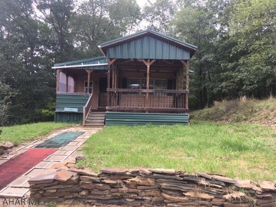 Kick back and relax in this cozy cabin just a few miles from Schellsburg and close to Shawnee park and lake. Sit on the deck and enjoy the sounds of nature and watch the deer and turkeys. 2 bedrooms, one bath, wood stove, oil heat, central air, detached heated utility building (this could easily be converted into a bunk-house!!!), shed, carport, 200 amp electric service, well and septic.