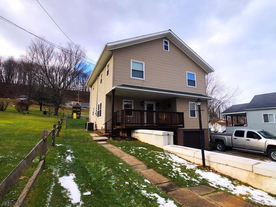 MOVE-IN READY!!! This Beautiful 4 bedroom, 2 full bath home located in Conemaugh Valley School District has been completely refinished in 2010. All doorways and hallways have been widened for wheelchair accessibility. One bedroom with double closet and wheelchair accessible bathroom on first floor. Kitchen has direct access to deck. Refinished hardwood floors throughout dining and living rooms. Second floor laundry room with built-in storage shelving. Two bedrooms on second floor with walk-in closets. Third bedroom on second floor with two closets. The one-car heated, integral garage is great for parking or storage space. Plenty of parking in large driveway. Central Air.  Fenced-in Yard. Security Cameras Included!