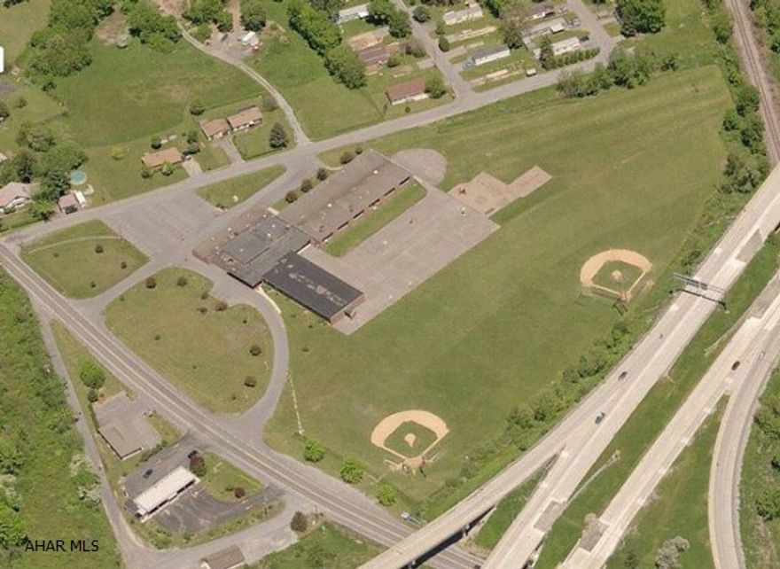 Former Allegheny 1 Elementary School. Includes kitchen, gym, classrooms, and offices. Large lot for expansion.