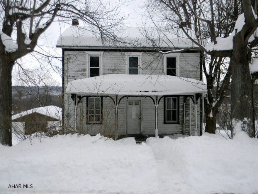 Two story frame house with 1-car detached garage on approx. 1/2 acre lot in Manns Choice Borough. Full unfinished walk-out basement, public sewer, no central heating source. Offered AS-IS. Immediately available.