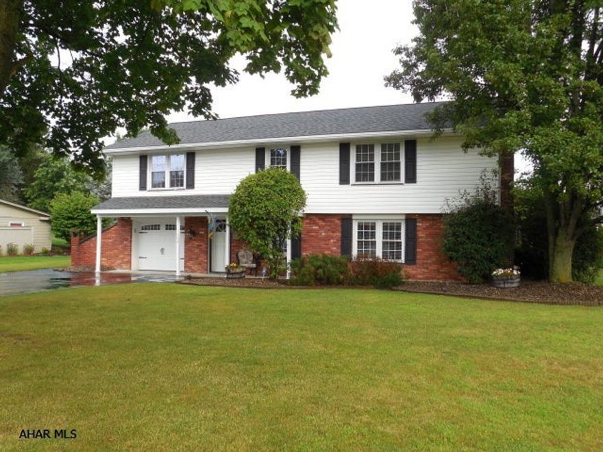 This Raised rancher is located in Penn Farm Estates. Custom kitchen with oak cabinetry, ceramic tile floor and small island with eating counter.  Three nice size bedrooms with beautiful hardwood floors.  Nice covered porch takes advantage of overlooking the in-ground pool and entertainment area.  Large family rm with brick fireplace and 3/4 bath.  This home is in immaculate condition and has Great curb appeal. Buy now and take advantage of the beautiful heated in-ground pool. To view virtual tour go to tool bar and  click movie reel.