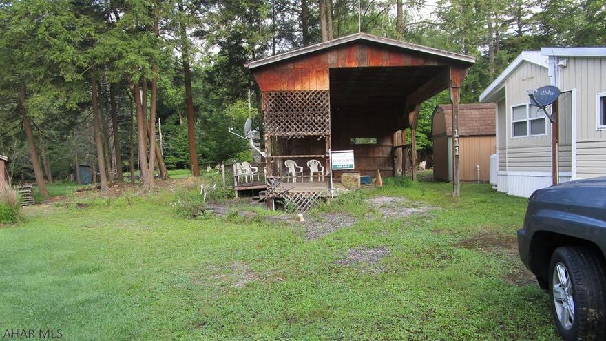 Campsite near the pond with a pavilion to protect your camper.  Located in Glendale Yearound, a gated recreational community adjacent to Prince Gallitzin State Park / Glendale Lake.  Six miles to Rock Run ATV Park.