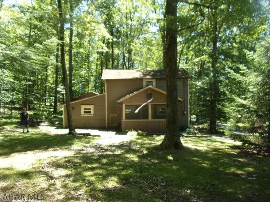 LOOKING FOR A FIXER-UPPER?  Motivated sellers have just drastically reduced this property and will consider reasonable offers!  Don't miss this opportunity to own this hunting camp/weekend getaway in the heart of beautiful Rothrock State Forest.   Furnishings and appliances are all included.  SEASONAL/RECREATIONAL HOUSING ONLY as the ground is leased from the State, so it must be a CASH sale.   Second floor has 2 rooms, with 12 total bunks and lockers.  3/4 bath on first floor.  Septic system was installed in 2005.  Spring fed water.  3 miles from Camp Blue Diamond, 5 mi. from Little Juniata River, and more!