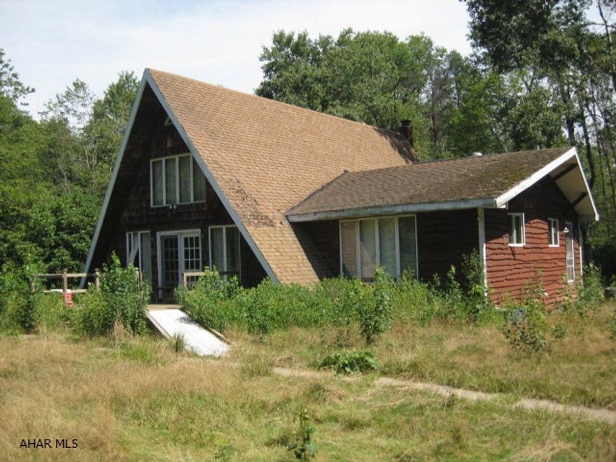 A-FRAME CABIN AND 22 ACRES WITH STREAM RUNNING THROUGH PROPERTY (Blacklick creek)  CABIN NEEDS MAJOR WORK AND MAY NEED RAZED.BASICALLY LAND VALUE
