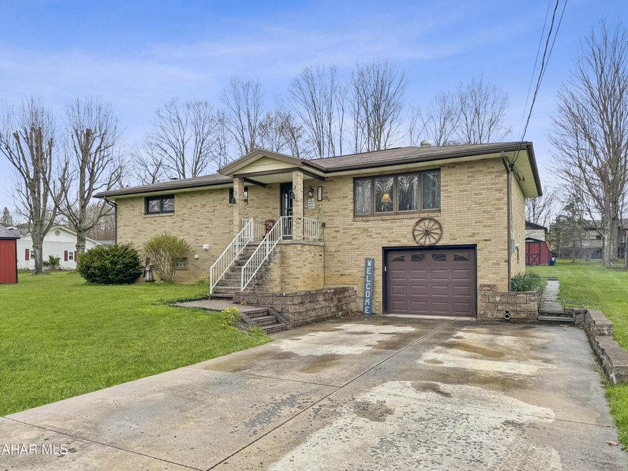 Welcome to 124 Chaser Street in the heart of Jackson Township, nestled within the Central Cambria School District. This stunning raised ranch home boasts an expansive layout on an oversized lot, brimming w/ delightful features. Step into the main floor to discover a generous living area, a dining room, a well-appointed eat-in kitchen complete w/ appliances, a fully updated bathroom w/ laundry, & three spacious bedrooms. The basement presents two finished rooms, w/ the framing already in progress for additional spaces. The current owners have jump-started the construction of a full bathroom in the basement & will provide all necessary materials to complete the project. Additionally, the basement houses a convenient one-car integral garage. Noteworthy highlights of this property include a brand-new heat pump for efficient heating & cooling, new flooring throughout the upper level, abundant off-street parking w/ an extra gravel area, two covered porches, a shed, a fire pit area, & a host of other amenities waiting to be explored. Schedule your exclusive tour today to experience the charm of this home firsthand!