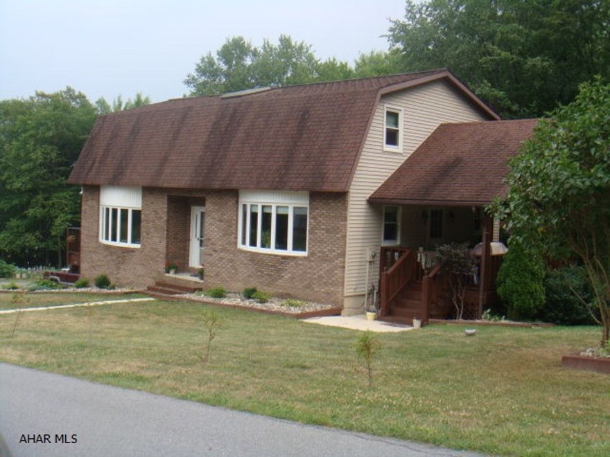 Gorgeous home in a private setting. Barn style home with 2-4x28 balcony style decks and 10x22 covered deck. 3BR with loft balcony overlooking entry way, sunken livingroom w/pellet stove, formal diningroom. Plenty of closet space & storage. Full unfinished basement and one car integral garage, paved driveway and stream along back of house. No words can describe the home. It's a must see to apprecaite it.