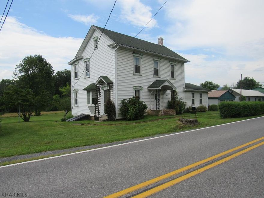 Older home on 1 acre with insulated windows, vinyl siding and garage. Also has a 13 acre lot included but not attached. (see photo)