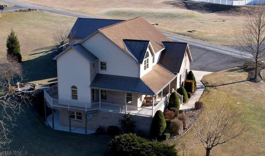 THIS IS A CUSTOM BUILT BILL WALTMAN HOME! Entertaining spaces flow seamlessly from interior to exterior spaces through the home's many windows and outdoor entertaining spaces on 2.96 Acres with four car garage. The home just seems to wrap you in its warmth and charm with its many custom features. There was no expense spared in the home's custom features like pocket doors, walls of glass, cathedral ceilings and radiant floor energy efficiency. Yes this is a home that will please even the most discriminating buyer. The master retreat with its transom windows, cathedral ceilings and huge walk in closet is fabulous. All bedrooms have walk in closets. A 3rd floor bonus room & lower level recreation room complete with bar, french doors and walk out to patio complete this house.