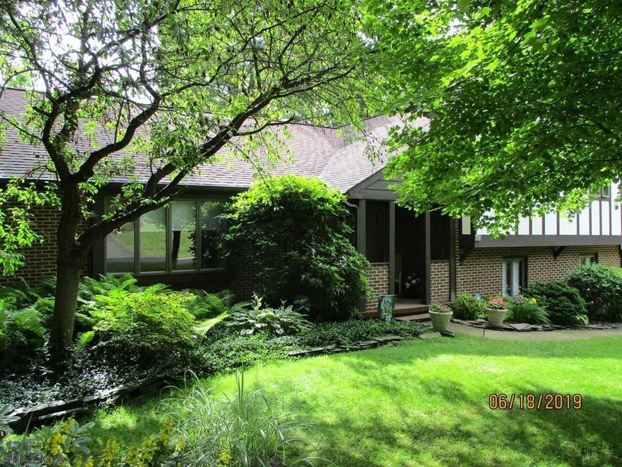 This lovely 4 bedrm, 2.5 bath home is situated on a large, beautifully landscaped private lot in a very desirable Altoona neighborhood. Living rm w/crown moulding, formal dining rm. Updated EIK w/granite c.tops and tile floor. Off the kitchen is a 10x28 deck w/sun setter awning. Great for entertaining and taking in the terrific view. Conveniently. located  laundry and powder rm.  Family rm w/gas fireplace and crown moulding. Slider  to a second deck 16x18 that leads to the rear yard. Basement has a family rm, newly carpeted plus  two additional rms .. Walkout entrance to a large fenced in yard. A separate rm, under the upper  family rm, creates terrific storage (you need to enter from the outside) Two car garage. This  home has been meticulously maintained.   Realtor owned.