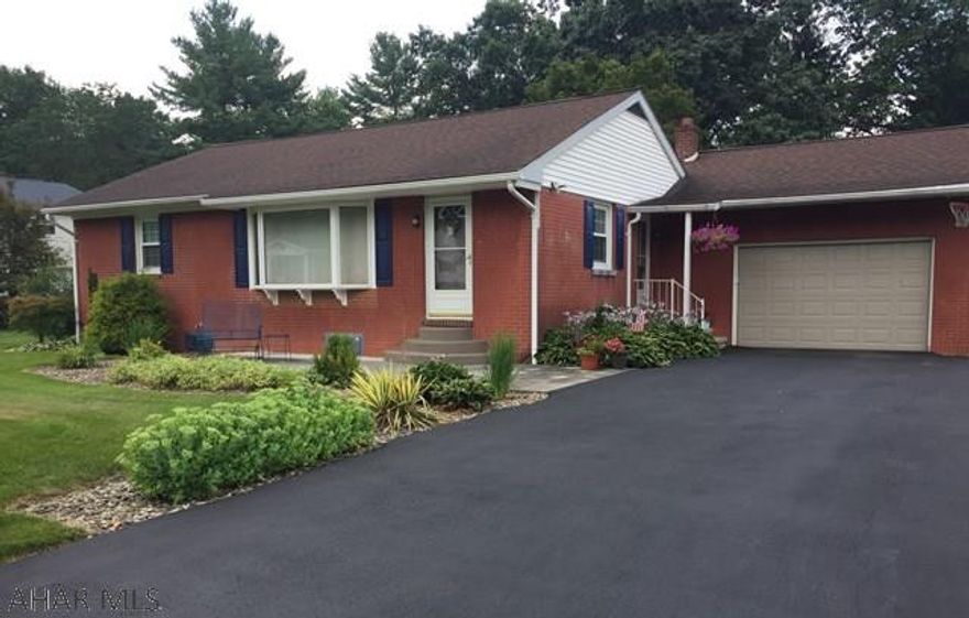 Sweet one story with attached garage, new windows, new garage door and opener, updated bath, cork floor in kitchen, hardwood floors throughout, covered patio, black top driveway, gas hot water heat and central air. Heated garage and laundry. Perfect Downsizer!!  (Crawl space is approx 5 ft high)