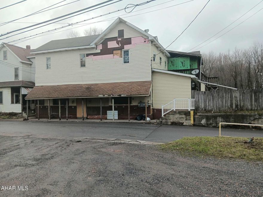 This unique mixed-use two-story building sits on a spacious lot and is ideally located near the local Conrail line, making it especially appealing to train enthusiasts. Steeped in local history, the property once served as a popular stop for blue-collar workers looking to enjoy a meal and a drink, and now offers incredible potential for its next chapter.

The building currently features four units, with two apartments already rented and generating income. A third unit on the second floor is nearly complete and just needs finishing touches, while the former bar on the main level presents a wide range of possibilities. It could be repurposed as a restaurant, bar, additional residential space, boutique storefront, or just about anything you can envision.

There's also strong potential for a boutique bed and breakfast, given the charm and layout of the building. The large lot offers ample off-street parking, further enhancing its versatility. Whether you're an investor, entrepreneur, or dreamer, this property is priced to sell and full of opportunity.