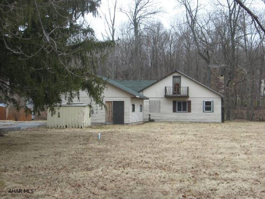 This large cottage located on Dunnings Creek needs finished but has loads of potential and many items already updated:  Kitchen cabinets, shingled roof, doors, plumbing (some breakage), wiring and mostly newer drywall throughout.  Offered in As Is condition.