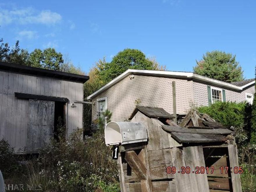 Double wide on piers in Cresson Shaft within walking distance of State Game Lands #279.  Nice split floor plan.  Each bedroom has generous closet space.  Needs a lot of work.  Mold & mildew from roof leaks.  Manufacturers sticker is missing so crucial information is not available.  As is where is sale. Cash buyers only due to condition & type of structure.  Sewer is likely a wildcat system. Employees and family members residing with employees of JPMorgan Chase Bank, N.A, its affiliates or subsidiaries are strictly prohibited from directly or indirectly purchasing any property owned by JPMorgan Chase Bank, N.A.