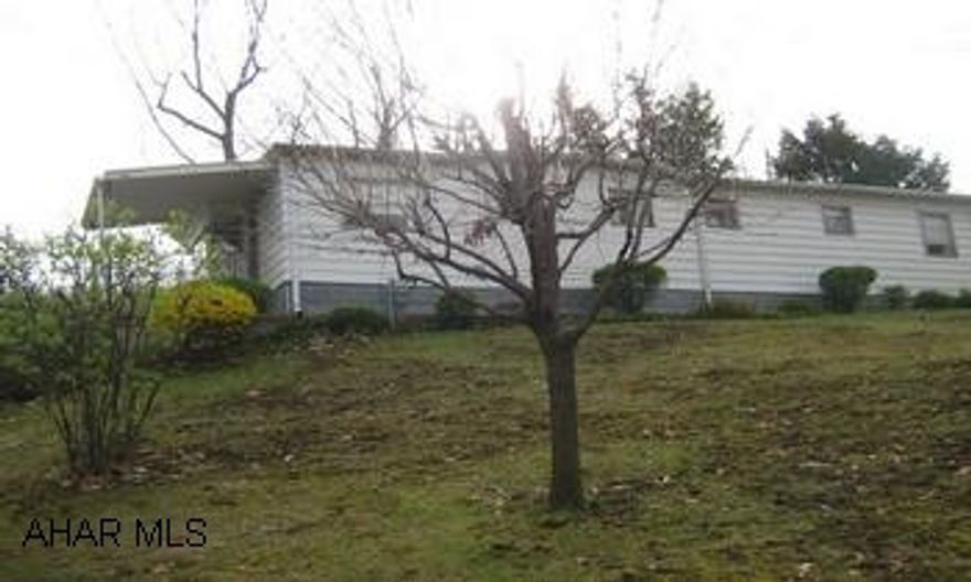 Cozy mobile home with addition. Well maintained. Carport and cement block storage building. Very nice 100x120 lot. Quiet and convient neighborhood.