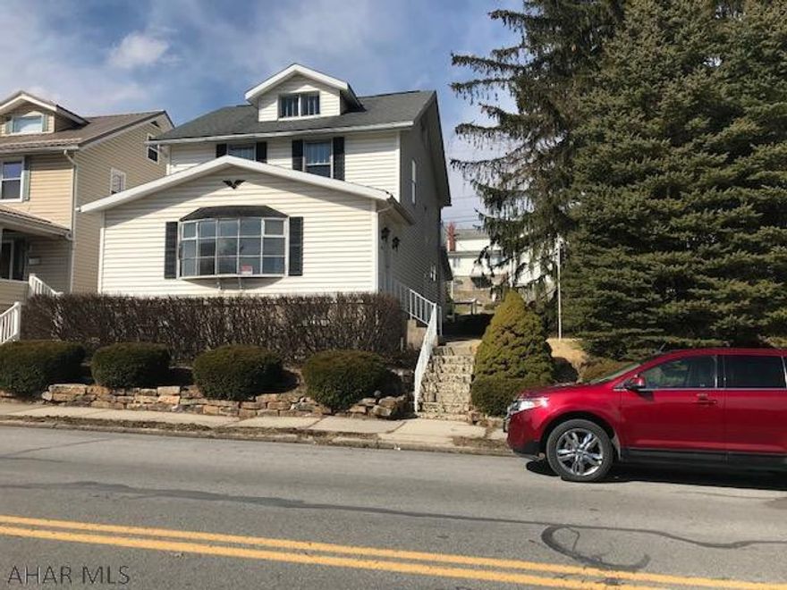 Home recently refurbished. Double lot, detached garage with alley entry.