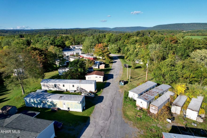 Calling all investors!  This is a one of a kind opportunity, a mobile home park with rental lots and owned manufactured homes.  This offers the best of both worlds, rental property and lots for lease.  There is more room for expansion of lots, new possibilities like storage units, RV parking, etc.  There is an owners property/manufactured home for new owner to live or housing for property manager.  The possibilities are endless with this property.  It is close to I70, PA Turnpike, and Route 30.  Don't miss this investment.