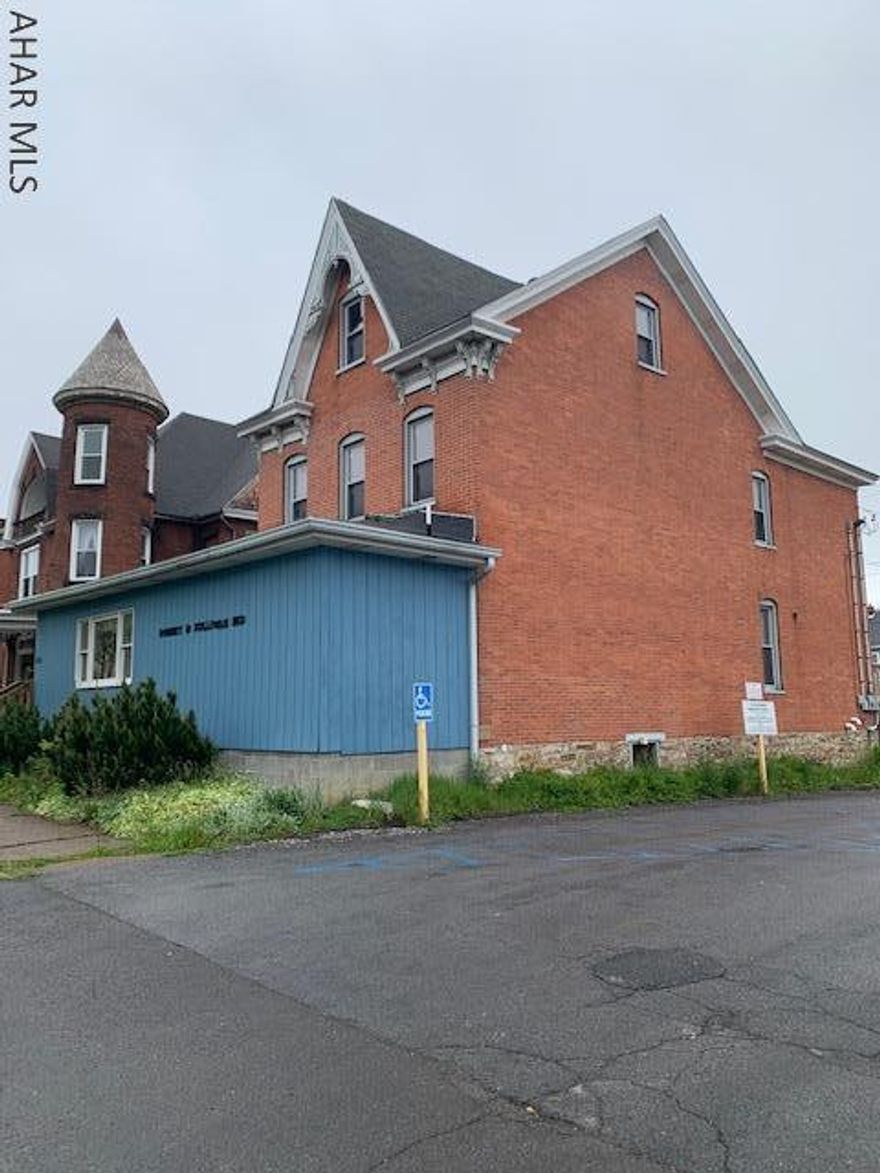 REDUCED PRICE! Professional office with endless possibilities! Large offices, 2 bathrooms, a cafe, reception, private office and waiting area- all in a heavy traffic area! Parking lot out back for easy access. Schedule your showing today! *Property has been winterized*