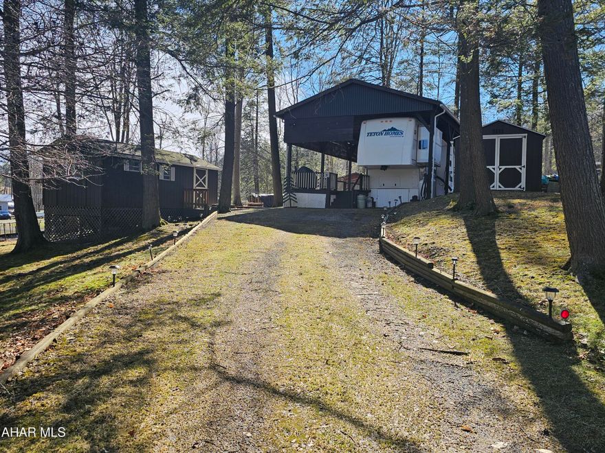 2002 Grand Teton 5th wheel camper on 2 lots inside Glendale Yearound. Camper is spacious and in excellent condition. It is under a large pavilion with deck. There are 2 sheds on the property. Automatic generator, central air, washer and dryer. Can be a getaway or your permanent home. Glendale Yearound is a gated community located minutes from Glendale Lake and Prince Gallitzin State Park. Community pool, basketball, tennis, security, and more.